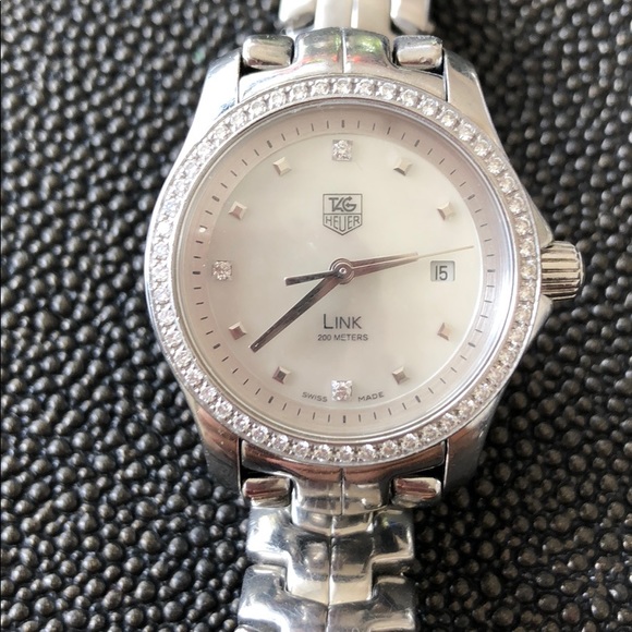 Tag Heuer diamond mother pearl face watch.